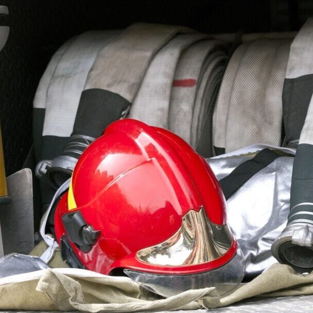 red fire helmet and hose